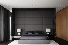 a large bed sitting in the middle of a bedroom next to a tall wooden wall