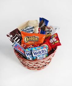 a basket filled with assorted candy and snacks