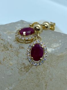 Ruby Gold Earring, Natural Ruby Gemstone Gold Earring, Dainty Gold Jewelry, Ruby Women Solitare Earring, Gift For Wife, Gold Ruby Earring *100% natural gemstone *14k solid gold *solid gold (NOT plated) *gemstone: ruby *gemstone: zircon *stone shape ruby: oval *stone shape zircon: round *stone ruby : 5x7 mm. *stone ruby ct. : 2.00-2.30 ct. *stones ruby : 2 pc. *stone zircon : 40 pcs. Exquisite Oval Earrings With Prong Setting, Exquisite Oval Prong-set Earrings, Exquisite Oval Prong Set Earrings, Ruby Earrings With Halo Setting In Fine Jewelry, Ruby Halo Earrings In Fine Jewelry Style, Ruby Halo Setting Earrings In Fine Jewelry, Ruby Halo Setting Earrings Fine Jewelry, Ruby Halo Setting Earrings, Elegant Ruby Earrings With Halo Setting