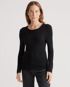 Try on a new level of luxury with our Featherweight Cashmere Ribbed Crewneck Sweater. Crafted to feel light as air without sacrificing warmth, our new fine-gauge featherweight cashmere styles are knit using a longer fiber length, making them more resistant to pilling and luxuriously soft. The delicate ribbed texture and seamless construction elevate this fitted crewneck silhouette, making it the updated classic you'll turn toward again and again.  | Quince | Women's Featherweight Cashmere Ribbed Navy And Copper, Cashmere Outfits, Leather Jacket With Hood, Cashmere Sweater Women, Womens Cashmere, Yarn Sizes, Light Weight Sweater, Crewneck Sweater, Black Charcoal