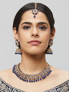 NAZRANAA JEWELS OFFERS A GREAT RANGE OF INDIAN JEWELRY FOR TODAY'S WOMAN WITH THE LATEST DESIGNS. THE BRAND IS COMMITTED TO PROVIDING ITS CUSTOMERS WITH THE HIGHEST QUALITY OF GOODS AND NEWEST DESIGNS. IT IS SUITED FOR A WOMAN WHO IS LOOKING TO STAY DATED WITH THE LATEST TRENDS. RADIANT ANTIQUE GOLD NECKLACE SET IS A PERFECT ACCESSORY FOR ANY NIGHT EVENT. IT IS SURE TO MAKE YOU STAND OUT IN A CROWDED ROOM. Traditional Indian Jewelry: Slight Color variations possible due to difference in screen a Festive Bridal Necklace With Matching Earrings, Blue Cutdana Necklace For Diwali, Kundan Bridal Necklace With Matching Earrings, Blue Kundan Necklace For Celebration, Temple Style, Traditional Heavy Blue Necklace, Traditional Blue Cutdana Necklace, Elegant Blue Meenakari Necklace, Tikka Indian Jewelry, Antique Gold Necklace