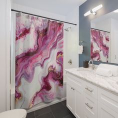 a bathroom with a marble shower curtain in the middle and two mirrors on the wall