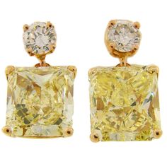 Fancy Yellow GIA and White Diamond Gold Two-Stone Stud Drop Earrings Luxury Yellow Gold Diamond Earrings For Evening, Luxury Yellow Diamond Cut Earrings, Formal Yellow Diamond Earrings With Diamond Cut, Yellow Diamond Earrings For Formal Occasions, Formal Yellow Diamond Cut Earrings, Formal Yellow Diamond Earrings, Luxury Gia Certified Yellow Gold Diamond Earrings, Luxury Yellow Diamond Drop Earrings, Elegant Yellow Diamond Earrings