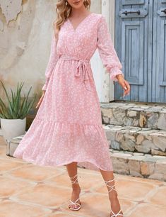 The Emes Shop dress is detailed with dainty floral prints. Features a surplice neck line. wrap style. long sleeves. flowy skirt. ruffle hem. and below knee length. Pair it with strappy sandals and a shoulder bag for a feminine look.MATERIAL:100% PolyesterMEASUREMENTS: Product Length49.21"-52.36"in 4-6-Small | Waist: 25-26.5 in | Chest: 33-34.5 in | Hips: 35-36.5 in 6-8-Medium | Waist: 26.5-28 in | Chest: 34.5-36 in | Hips: 36.5-38 in 8-10-Large | Waist: 28-29.5 in | Chest: 36-37.5 in | Hips: 38- Modest V-neck Midi Dress For Spring, Flowy Spring Maxi Dress With Ruffle Hem, Long Sleeve Ditsy Floral Dress For Spring, Spring Floral Long Sleeve Dress With Ruffles, Spring Chiffon Midi Dress With Tiered Design, Spring Midi Dress With Surplice Neckline For Garden Party, Spring Midi Dress For Garden Party With Surplice Neckline, Summer Long-sleeve Maxi Dress With Ruffle Hem, Spring Chiffon Midi Dress With Ruffle Hem