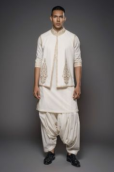 Ivory bundi featuring golden threadwork floral mughal motifs. Comes with matching threadwork kurta, dhoti and foil printed stole. - Aza Fashions Off White Nehru Jacket With Resham Embroidery, Off White Bandhgala With Cutdana For Diwali, Designer White Bandhgala For Navratri, White Designer Bandhgala For Navratri, Designer Off-white Bandhgala With Cutdana, Traditional Off White Nehru Jacket With Naqshi, White Nehru Jacket With Cutdana For Reception, Off White Nehru Jacket For Eid Reception, Designer White Nehru Jacket With Naqshi