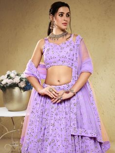 Introducing our spectacular lavender embroidered georgette bridesmaid lehenga choli, a truly stunning ensemble crafted with the utmost care and attention to detail. This lavender lehenga is made from georgette material, known for its lightweight and flowy nature, ensuring maximum comfort throughout your special occasions. The lehenga features exquisite sequin and embroidered work, adding a touch of elegance and glamour to your overall look.
The set includes a similar color georgette choli and du Lavender Anarkali Dress With Intricate Embroidery, Anarkali Lavender Set With Mirror Work, Fitted Purple Party Wear Sharara, Anarkali Set With Mirror Work In Lavender, Bollywood Style Lavender Georgette Lehenga, Festive Lavender Georgette Sharara, Lavender Bollywood Dress With Resham Embroidery, Fitted Lavender Bollywood Sharara, Fitted Lavender Dress With Dupatta