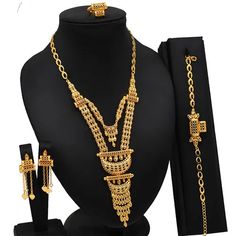 Indulge in luxury with this exquisite Necklace Set, perfect for wedding parties. With its opulent design and superior craftsmanship, this set features a necklace, bracelet, earrings, and ring. Make a lasting impression and elevate your style with this luxurious jewelry set." Ceremonial Hand Set Gold Jewelry Sets, Ceremonial Gold Hand Set Jewelry Sets, Ceremonial Gold Jewelry Sets With Elegant Design, Ceremonial Hand Set Gold Plated Jewelry Sets, Ceremonial Gold Plated Jewelry Sets, Ceremonial Gold-plated Jewelry, Elegant 22k Gold Bridal Sets, Gold Jewelry Set, Luxurious Jewelry