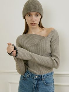 Editor's NoteOURCOMOS draws inspiration from the beautiful Lake Como in northern Italy, aiming to express deep and beautiful inner elements with a moody atmosphere.- Made of Merino wool and cashmere blended fabric- Vertically ribbed pattern- Comfortable and flexible fit- Unbalance boat neck design with one side off-shoulder- Contrasting color of trimming at the cuff- High-quality finish for durability- Classic and feminine moodMeasurements(in.)One Size- Shoulder: 14.17 in.- Chest: 13.39 in.- Hem: 12.60 in.- Sleeve: 5.12 in. (W) * 24.80 in. (L)- Cuff: 3.54 in.- Length: 21.65 in.*Model Info: Height: 5.74 ft. / Bust: 30 in. / Waist: 23 in. / Hips: 34 in.*The model is wearing ONE SIZE.Composition & Care- Material: Shell: 45% Nylon, 42% Polyester, 10% Merino Wool, 3% Cashmere- Dry clean rec Elegant Ribbed Knit Top For Winter, Elegant Knit Top For Winter, Ribbed Cashmere Knit Top For Fall, Chic Cashmere Knit Top For Winter, Chic Winter Cashmere Knit Top, Fine Knit Cashmere Top For Winter, Winter Wool Fine Knit Top, Winter Cashmere Knit Top, Moody Atmosphere