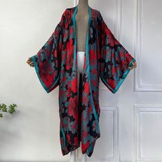 One Size fits S-3X/4X Kimono length: 58inch Material: Poly Silk (a lightweight, smooth, and shiny fabric that drapes and flows very well. An affordable alternative to silk) One Size Fits Most Size Chart Long Red Kimono For Vacation, Elegant Red Kimono For Spring, Red Beach Kimono For Fall, One Size Red Kimono For Fall, Black Silk Kimono For Summer, Red Kimono For Fall, Elegant Red Kimono For Summer, Elegant Red Summer Kimono, Spring Red Flowy Kimono