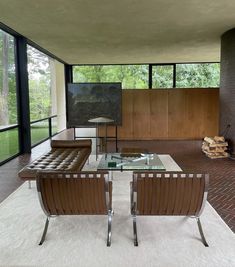 a living room with two chairs and a table