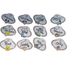 twelve disney pin badges with winnie the pooh on them