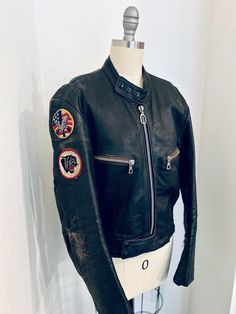 Vintage 1970s BAD GIRL Black Leather Biker Jacket w/super cool patches! Distressed Classic Moto Style Made by "Harro Kombi" - made in Germany 100% leather, distressed  Size M (medium) Chest:  36" Sleeve:  24.5" Length:  23.5" Shoulder to shoulder: 18" Condition: All zips & poppers in perfect working condition COOL DISTRESSED CONDITION Vintage Leather Motorcycle Jacket With Long Sleeves, Vintage Leather Jacket For Motorcycling, Vintage Brown Biker Jacket For Motorcycling, Fitted Cafe Racer Biker Jacket For Motorcycling, Vintage Outerwear For Motorcycling In Fall, Vintage Fall Outerwear For Motorcycling, Retro Fitted Biker Jacket With Long Sleeves, Black Retro Biker Jacket For Motorcycling, Retro Fitted Long Sleeve Biker Jacket