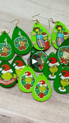 the grinch christmas earrings are green and have cartoon characters on them