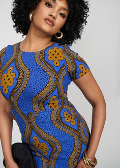 Style#: 1059/P1059 Be sophisticated queen, in this Sabella Women's African Print Stretch Dress in our Gold Blue Motif print! The above-knee length and crewneck give coverage making the perfect versatile dress to be worn from the office to a night out. Description Stretch Woven Fitted Dress Crew Neck Above Knee Length Invisible Zipper with Hook and Eye at Center Back 2 Pockets at Sides 72% Rayon/ 24% Nylon/ 4% Spandex Designed in the USA, imported Length Range: 33 1/2" - 35 1/2" Care Instructions Fitted Blue Dresses With All Over Print, Fitted Blue Dress With All Over Print, Blue Printed Knee-length Mini Dress, Graphic Print Stretch Crew Neck Dress, Stretch Graphic Print Dress With Crew Neck, Crew Neck Graphic Print Stretch Dress, Stretch Graphic Print Crew Neck Dress, Blue Fitted Printed Dress, Fitted Blue Printed Dress