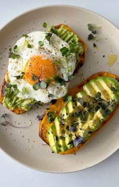 an egg and avocado toast on a plate