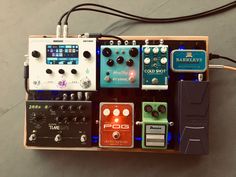 an assortment of different pedals and effects in a box