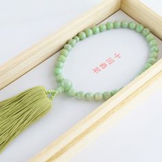 Chinese Jade Stone Buddhist Prayer Beads Characteristics of the product Material : Chinese Jadeite, Silk cord Head bead : about 10mm (0.39in) Main bead : about 8mm (0.31in) Inner circumference : about 25cm (9.84in) Tassel length : about 9cm (3.54in) Handmade in Kyoto, JAPAN About Chinese Jade Chinese jade refers to the jade mined or carved in China from the Neolithic onward. It has long been prized by the Chinese who called it "The heavenly gem", Confucius himself thought it was the representati Elegant Jade Beads As Gift, Round Jade Beads For Gifts, Jade Beads Gift, Jade Beads With Large Beads For Gifts, Gift Jade Beads With Large Beads, Jade Beaded Necklaces With Large Beads For Gifts, Jade Beaded Necklaces With Round Beads, Jade Gemstone Beads, Hand-strung Jade Beaded Necklaces With Round Beads