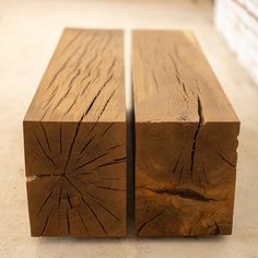 two pieces of wood sitting on top of a floor