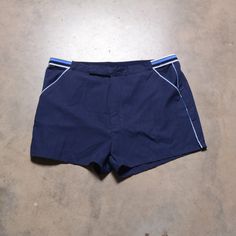 Classic Royal Knight tennis trunks. Excellent vintage condition. Labeled as a 38. Please see actual measurements below.  Waist: 36-40" Inseam: 2.5" Outseam: 13.5" If you would like to see additional photos or have any other questions, please do not hesitate to ask, and thanks for looking! Shipping disclaimer: All domestic orders under 16oz ship USPS Ground Advantage. All domestic orders over 16oz ship USPS priority mail. All international orders under 4lbs ship via Etsy's Global Shipping Program Cheap Retro Sports Shorts, Retro Blue Swimming Bottoms, Retro Blue Swim Bottoms, Retro Blue Athletic Shorts, Sporty Fitted Cotton Swim Trunks, Vintage Blue Sports Shorts, Retro Athletic Shorts For Sports, Retro Bottoms With Built-in Shorts For Swimming, Tennis Shorts