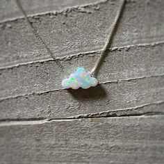 "Tiny Opal Cloud/White Fire Opal/Birthday Gift For Her/October Birthstone/Minimalist Necklace/Dream Big/Celestial Jewelry/Little Charm/Clouds ** Ships out in 1-2 business days! ** Adorable White Opal Cloud Charm that will come on a Sterling Silver or Gold Filled Box Chain. Very dainty, perfect minimalist necklace! - Opal measures approx. 12mm x 7.3mm - 100% Solid .925 Sterling Silver or 14/20 Gold Filled Box Chain ** Choose your desired chain length from the drop down menu. If you are unsure of White Round Necklace For Birthday Gift, White Round Necklaces For Birthday Gift, White Spiritual Necklace For Birthday, Minimalist White Necklace For Birthday, Spiritual White Necklace For Birthday, Celestial White Jewelry With Birthstone, White Pendant Necklace For Birthday Gift, White Pendant Jewelry For Birthday Gift, Spiritual White Jewelry For Birthday