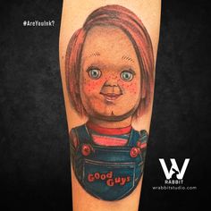 a tattoo with an image of a doll on it