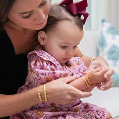 WILL ARRIVE IN TIME FOR CHRISTMAS! Baby’s first bracelet! Meet the Baby Marie Bracelet — a very special addition to our collection in honor of Christina’s daughter, Marie. Jewelry holds a special place in the timeline of a family, often passed from generation to generation. Perfect for family photos, baptisms, and other special moments in a newborn and infant’s life, this baby bracelet is a beautiful gift that will be cherished. Modeled after a baby bracelet passed down in Christina’s family, th Combat Boots Heels, Baby Jewelry Gold, Felt Cowboy Hats, Concert Fashion, Baby Bracelet, Baby Jewelry, Girl With Hat, Matching Bracelets, Baby Size