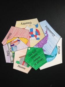 a bunch of different colored papers with words on them that are cut out to look like hexagons