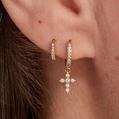 Delicate and sparkly, our Mini Crystal Cross Earrings are the perfect dainty addition to your everyday earring collection. Ideal as a gift for christenings or special occasions, these cross hoop earrings make an elegant gift for a godparent or loved one to treasure.&nbsp;18K Champagne Gold PlatedMini Crystal Cross: 0.3 x 0.2Hoop: 0.4 diameterSent with love in a complimentary gift box Small Cross Earrings, Gift Single Cross Pendant Earring, Minimalist Cross Pendant Earrings, Gold Cross Hypoallergenic Earrings, Elegant Hypoallergenic Cross-shaped Earrings, Crystal Dice, Personalised Jewellery Necklaces, Engraved Earrings, Crystal Cross