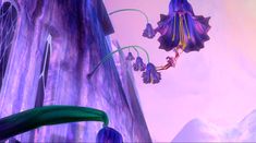 an animated image of a purple flower flying through the air