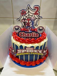 a spiderman themed birthday cake in a box