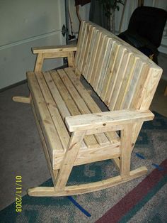 a wooden bench sitting on top of a carpeted floor