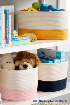 two baskets with stuffed animals in them are on the shelf next to books and toys