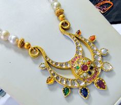 Vintage antique 23 K solid gold and natural Navratna gemstones set large pendant strung together with pearls and gold beads. Great one of type collection piece in very good condition. Length-Free size, Size of pendant-10/9 cm, gross weight-137 grams, pendant weight only-76 grams, Material-23 K gold, Natural uncut Diamonds, and Natural Navratna gemstones. Temple Jewelry Style Chandbali Pearl Necklace With Pendant, Festive Temple Jewelry In Gold, Traditional Gemstone Beads And Cabochons For Gifts, Traditional Pearl Pendant Necklace For Festivals, Gold Pearl Necklace With Gemstone Beads Pendant, Traditional Yellow Gold Kundan Necklace With Gemstones, Traditional Pearl Necklace With Gemstone Beads For Jewelry Making, Traditional Pearl Necklace With Round Beads, Traditional Kundan Necklace With Round Gemstone Beads