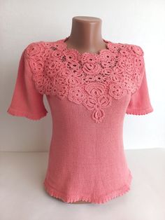 Introducing a charming addition to your wardrobe: a meticulously crafted crochet blouse exuding elegance and femininity.  This stunning women's blouse showcases the intricate artistry of Irish lace, elevating its allure with delicate motifs and fine craftsmanship. Fashioned in a soft, dreamy pink hue, this summer essential embodies grace and sophistication, perfect for warm-weather outings and leisurely strolls.  Handcrafted from premium cotton yarn, this crochet blouse offers comfort alongside Cotton Lace Crochet Top With Lace Trim, Feminine Cotton Crochet Top With Crochet Trim, Feminine Short Sleeve Blouse With Crochet Trim, Cotton Lace Top With Lace Work, Feminine Crochet Lace Top, Feminine Fitted Crochet Top With Crochet Trim, Feminine Cotton Crochet Top, Fitted Feminine Crochet Top With Crochet Trim, Fitted Lace Top With Crochet Trim