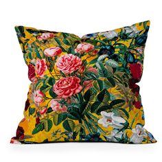 a yellow floral pillow with pink flowers on the front and green leaves on the back