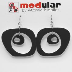 "Modern art earrings inspired by mid century modern retro design and my hanging art mobiles. Wearable art! Custom handmade by me in my studio in Los Angeles. No-worry, no-pain hypo-allergenic titanium ear wire, stainless steel rings, and adorably mod acrylic dangle shapes. Show your mid century modern style with these modern earrings! Arrives in lovely gift box with ribbon and includes free 2020 Atomic Mobiles Art Catalog. CHOOSE FROM 2 SIZES: Medium: 2 1/2\"h x 1 7/8\" w Small: 1 3/4\"h x 1 1/2 Modern Adjustable Earrings, Modern Adjustable Earrings For Pierced Ears, Handmade Black Contemporary Earrings, Modern Handmade Earrings, Modern Dangle Plug Earrings For Party, Contemporary Handmade Black Earrings, Modern Adjustable Nickel-free Plug Earrings, Modern Dangle Plug Earrings, Modern Jewelry With Abstract Design For Gift