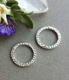 This listing is for 4 or 10 pcs of these Silver 19mm Hammered Rings by Tierra Cast. These lovely rings feature a hammered texture on the front and back and a shiny silver-plated finish. They are solid, sturdy, closed rings. These high-quality components are made of electroplated pewter here in the US and are 100% lead-free. Each ring measures approximately 19mm wide x 2mm thick with an 14.3mm inner diameter. These pieces are extremely lightweight, weighing approximately 1.4 grams each. Please ch Hammered Ring Silver, Pewter Ring, Hammered Gold Ring, Hammered Silver Ring, Hammered Ring, Hammered Rings, Small Gift Boxes, Lovely Ring, Shiny Silver