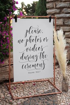 a sign that says please no photos or videos during the ceremony