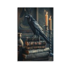 a black bird sitting on top of books next to two candles and a candle holder