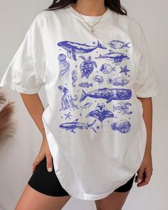 Marine biology, sea animal beachy t shirt. HOW TO ORDER ➀ Select color  ➁ Select the size (Please check the measurement guide)    ✧ Size up 1-2 sizes for a baggy or oversized fit. ➂ Add to cart ✦ The model is wearing size L for an oversized look. DETAILS ✦ 100% Heavy Cotton Tee (Other styles available upon request) ✦ Crew neckline ✦ Direct-to-garment printing - no vinyl, decal, or iron-on technique ✦ Our designs are printed on the garment to last a long time and may not appear as 'glossy' or sat White Fish Print Shirt For Summer, Casual Blue Tops With Fish Print, White Short Sleeve Shirt With Fish Print, White Casual Shirt With Fish Print, White Cotton Shirt With Fish Print, Blue Fish Print Top For Summer, Blue Short Sleeve Top With Fish Print, Casual White Fish Print Top, Summer Fish Print Crew Neck Tops