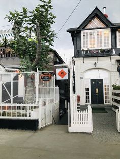 a house with white picket fence surrounding it