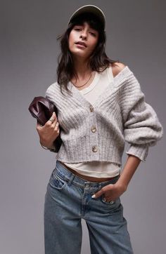 Feel the warmth of this cropped wool-kissed cardi knit with soft ribbing at the sleeves, back and hem. Front button closure V-neck Long sleeves Ribbed cuffs and hem 70% polyester, 21% nylon, 8% wool, 1% elastane Machine wash, line dry Imported Cozy Cropped Cardigan For Winter, Cropped Fall Cardigan, Crop Cardigan, Fabric Gift Bags, Fabric Gifts, Free Fabric, Cropped Cardigan, Sweater Top, Top Brands