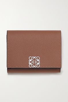 Loewe's wallet is made from textured-leather and minimally detailed with an 'Anagram' plaque at the front. It opens to a well-organized interior equipped with six card slots, a bill sleeve and a snap-fastening pocket for your change and receipts. Luxury Wallets With Grained Texture For Formal Occasions, Elegant Leather Wallet With Grained Texture, Elegant Leather Wallets With Engraved Logo, Loewe Pouch, Loewe Wallet, Elegant Compact Leather Trifold Wallet, Luxury Leather Wallet With Grained Texture, Loewe T Pouch, Loewe Brand Identity