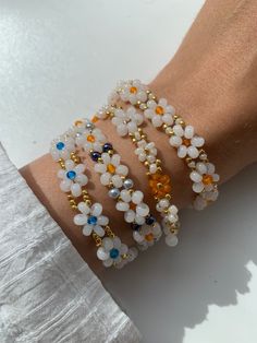 cute beaded bracelets in daisy design Daisy Beaded Bracelet | different colors: gold, white, rose, orange, blue | Daisy | Pearls | Pearl Jewelry | Miyuki / glass beads White Delicate Beaded Bracelet, Delicate White Flower Beaded Bracelets, Delicate White Flower Shaped Beaded Bracelets, Delicate White Flower Bracelets, Delicate White Adjustable Crystal Bracelet, Handmade White Crystal Bracelet With Flower Shape, Handmade White Crystal Bracelet In Flower Shape, White Flower Charm Jewelry For Friendship, Handmade White Crystal Flower Bracelet