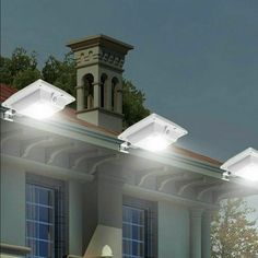 there are three lights that are on the roof of this house and one light is turned on