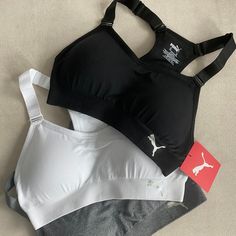 This Is A Brand New 3-Pack Of Women's Puma Seamless Sport Bras. They Are Medium Support, Padded, And Either Black, White, Or Gray In Color. All Are A Size Xs And You Will Receive Exactly What Is Pictured! Features: Puma Black Pack Includes (1) Black, (1) Gray And (1) White Bra Medium Impact Moisture Wicking Removable Cups Wire-Free Comfort Racerback 360 Degree Seamless Stretch Structured Body Mapping Puma Coolcell Moisture Control Ships Same/Next Day For Quick Delivery! Seamless Sports Bra For Sports Season, Seamless Construction Sports Bra, Sport Bras, Puma Sport, Best Sports Bras, White Bras, Black Seamless, Padded Sports Bra, Seamless Sports Bra