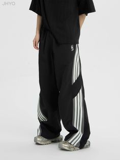 Track pants with a side line.

This season's trendy sports style loose and wide silhouette.

A must-have item that has a loose yet fashionable feel and is perfect for a clean look.
◾️Model
Height/Weight：168cm(66.1in)/47.5kg(104.7lb)
Fitting Size：S

Height/Weight：183cm(72.0in)/47.5kg(145.5lb)
Fitting Size：XL
◾️Material
nylon 100% Casual Pants With Contrast Stripes For Streetwear, Casual Streetwear Pants With Contrast Stripes, Athleisure Pants With Contrast Stripes For Streetwear, Athleisure Streetwear Pants With Contrast Stripes, Sporty Black Wide Leg Pants For Spring, Black Pants With Contrast Stripes For Streetwear, Streetwear Wide Leg Bottoms With Three Stripes, Streetwear Wide Leg Bottoms With Side Stripes, Sporty Black Wide Leg Pants With Pockets