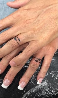 100 Unique Wedding Ring Tattoos You’ll Need to See - Tattoo Me Now |  bow and arrow tattoo couple design Tattoo Ring Finger, Tatoo Ring, Wedding Ring Finger Tattoos, Wedding Ring Tattoos, Ring Finger Tattoo, Infinity Tattoo On Wrist, Ring Tattoo Designs, Wedding Band Tattoo, Pink Rose Tattoos