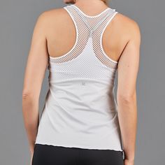 Active Lifestyle ApparelDesigned and made in USA DESCRIPTION Layered Strap Top - fitted athletic top with layered effect. Self bra and pockets for cups. DETAILS & FIT Athletic fit. FABRIC & CARE 80% Polyester / 20% Spandex SPF 40+ inherent in the solid fabric Machine wash cold, do not bleach, tumble dry low, cool iron, do not dry clean, do not hand wash White Compression Top With Built-in Bra, Sleeveless Workout Tops With Built-in Cups, Sports Tops With Built-in Cups And Stretch, Athleisure Tops With Built-in Bra For Training, Sporty Workout Tops With Built-in Cups, Athleisure Tops With Built-in Cups For Workout, Stretch Sleeveless Activewear With Built-in Cups, White Athleisure Top With Built-in Bra, White Breathable Sleeveless Top