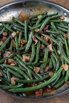 green beans and bacon cooking in a skillet